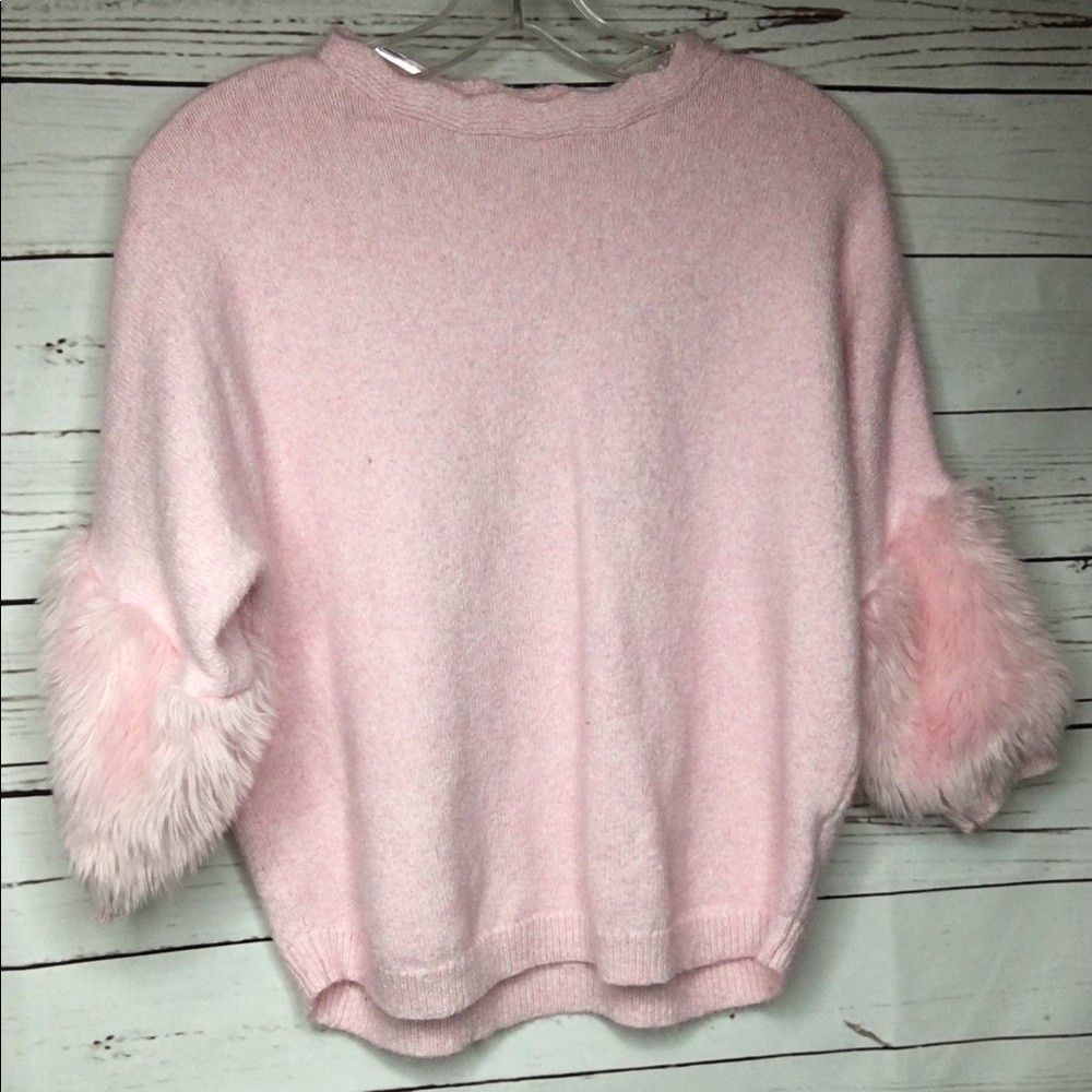 Pink sweater with fluff on the sides